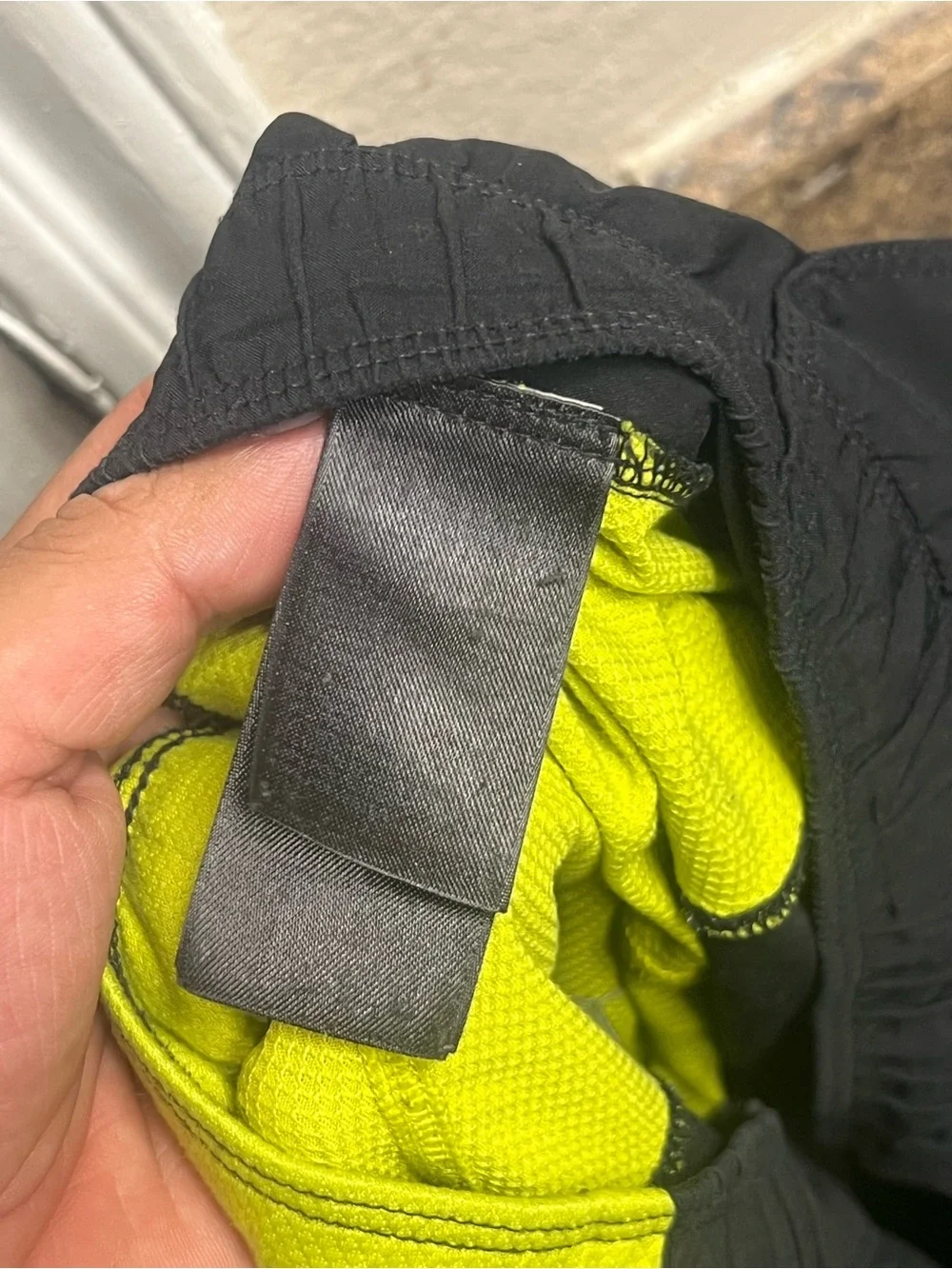The North Face Men's Black Swim Shorts with Neon Yellow Side Panels